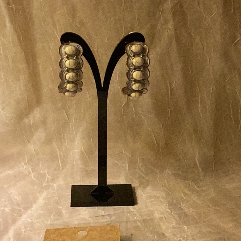 New in package Rose gold metal earrings w/white inlaid design & 7 stones- 1 chip